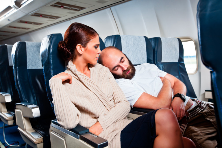 generic-passengers-in-airplane-sleeping-on-shoulder-small.jpg