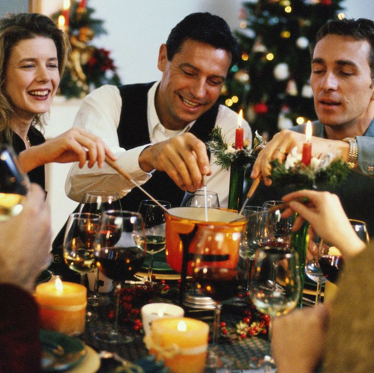 CHRISTMAS friends-dinner-christmas-home-fondue-royalty-free-image-1600443227.jpg