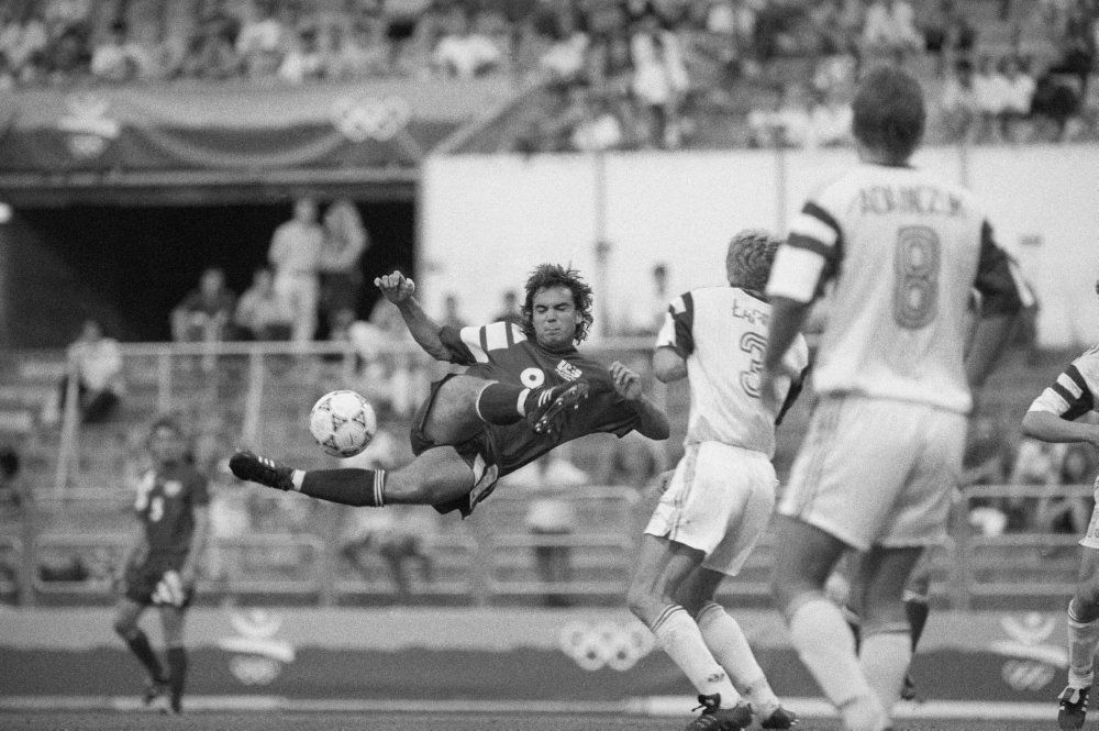 Boom! Stephan Leonard Snow of the U.S. soccer team, left, tries to shoot the bal.jpg