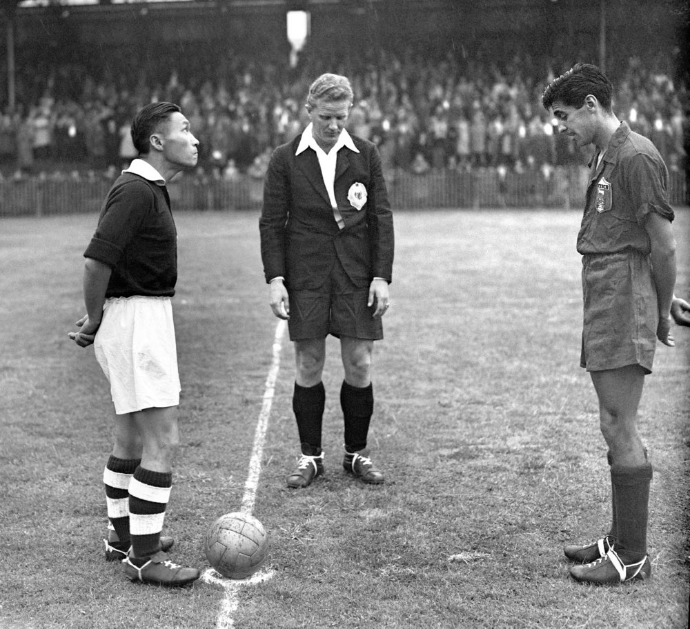 Korea's captain (left) and Mexico's captain (right) toss up prior to.jpg