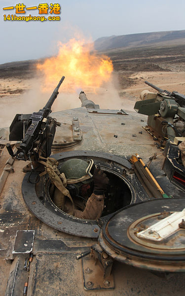 M1A1 firing its main gun as seen from the loader\'s hatch. The M240 is vi.jpg