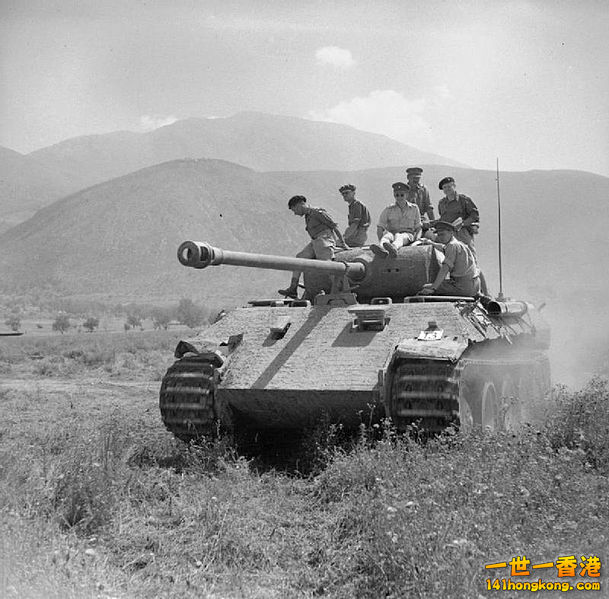 British officers ride on a captured Panther tank in Italy June 1944.jpg