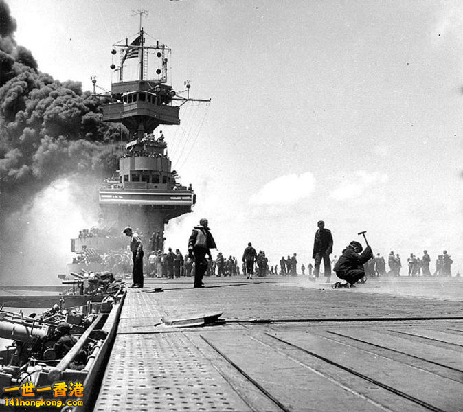 Smoke pours from Yorktown after being hit in the boilers by Japanese dive bomber.jpg