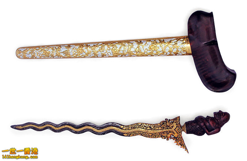 A decorative kris with a figure of Semar as the handle. The blade has thirteen luk..jpg