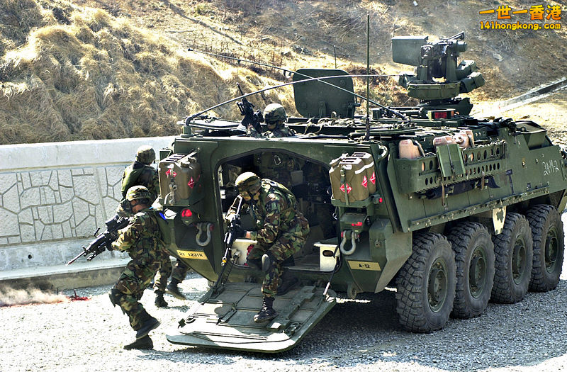 Stryker team members deploying from the rear ramp.jpg