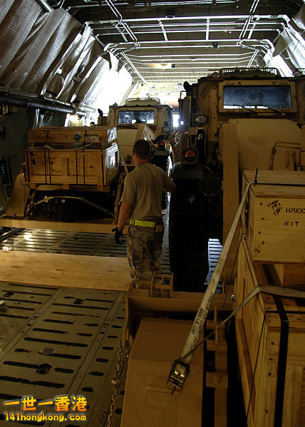 Excavators inside a C-5. Loadmasters ensure cargo is secured and balanced before.jpg
