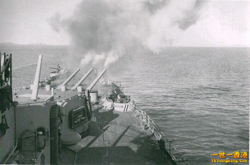 The after turret of the U.S. Navy heavy cruiser USS Toledo (CA-133) fires its 8-.jpg