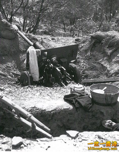 An abandoned Soviet-made North Korean 76 mm divisional gun M1942 (ZiS-3) on a hi.jpg