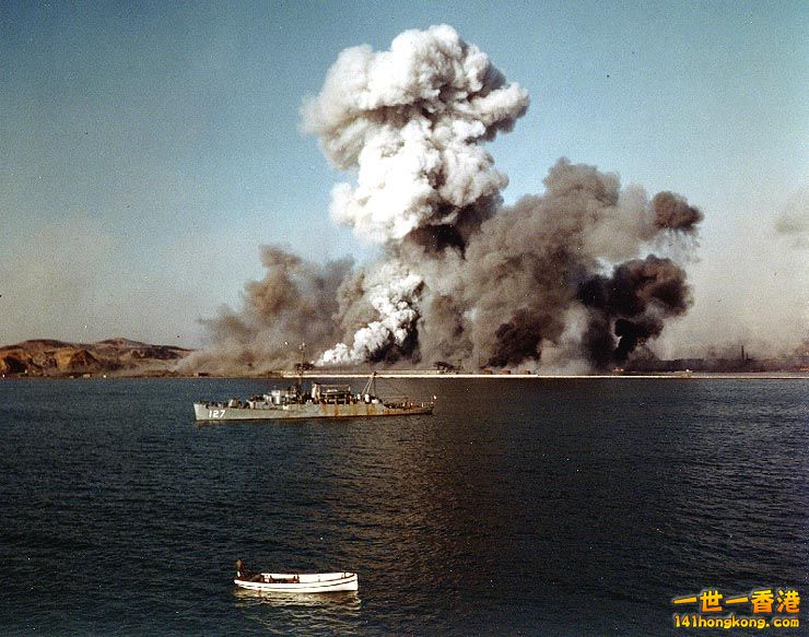 The U.S. Navy high-speed transport USS Begor (APD-127) observes the destruction .jpg