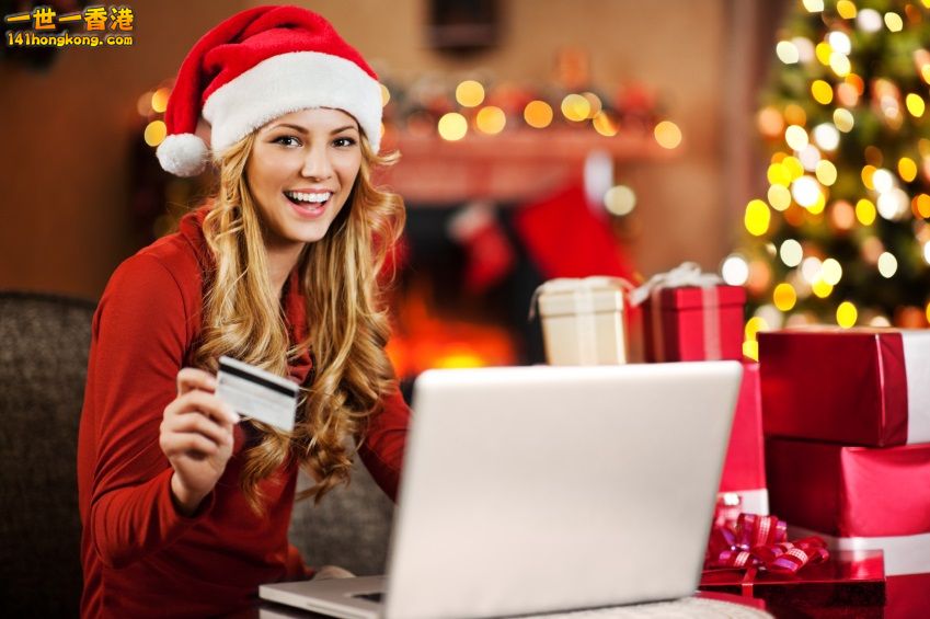 ___girl_christmas_shopping_online_with_credit_card_iStock_000021878112Small.jpg
