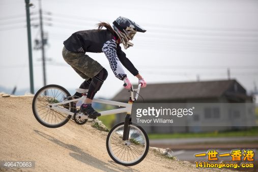 496470663-young-woman-racing-a-bmx-bike-on-a-track-gettyimages.jpg