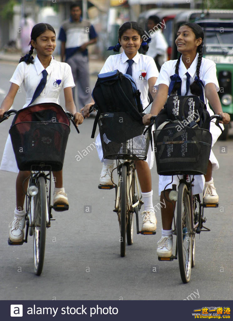 schoolgirls-on-bikes-sri-lanka-asia-AWT9N3.jpg