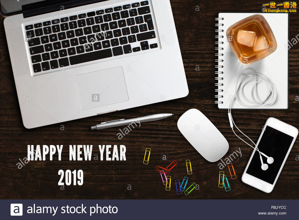 computer-workspace-with-smartphone-a-drink-and-the-message-happy-new-year-2019-o.jpg