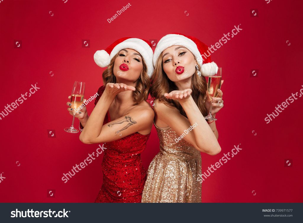 stock-photo-portrait-of-two-young-attractive-girls-in-christmas-hats-and-dresses.jpg