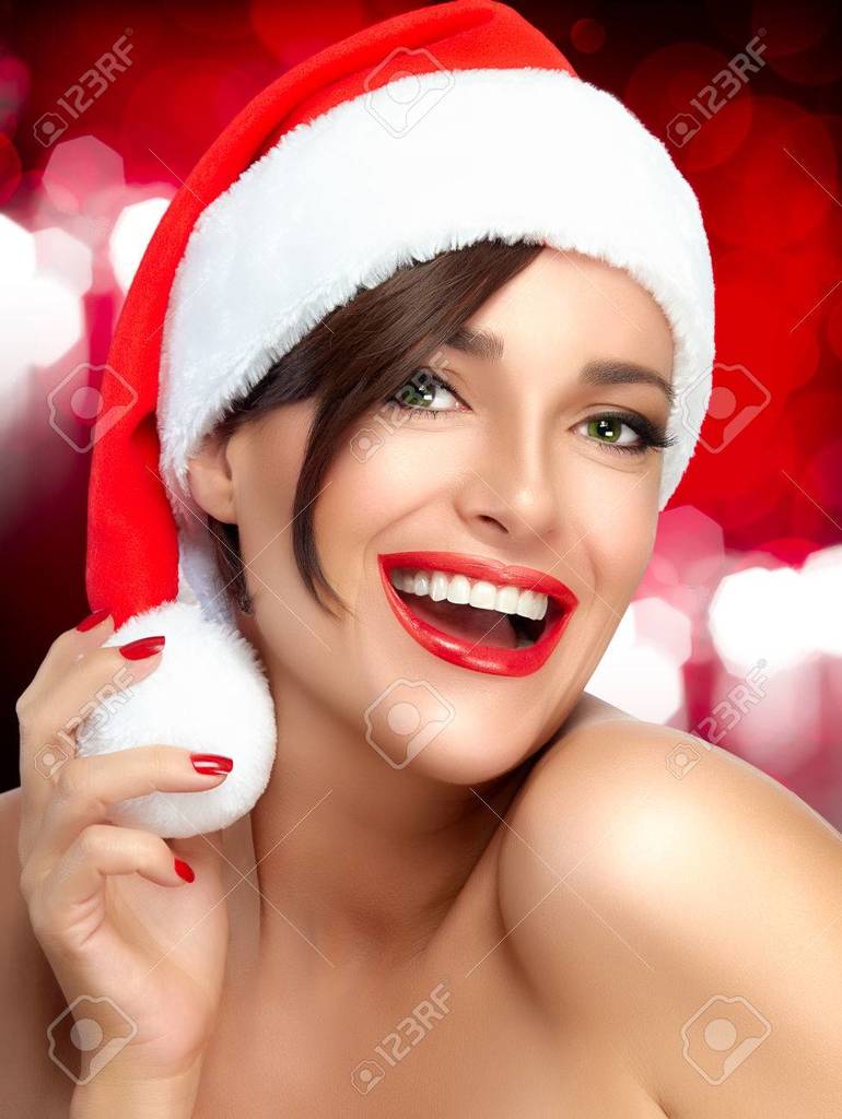 13-32-26-33581677-merry-christmas-happy-christmas-girl-in-santa-hat-with-a-beaut.jpg