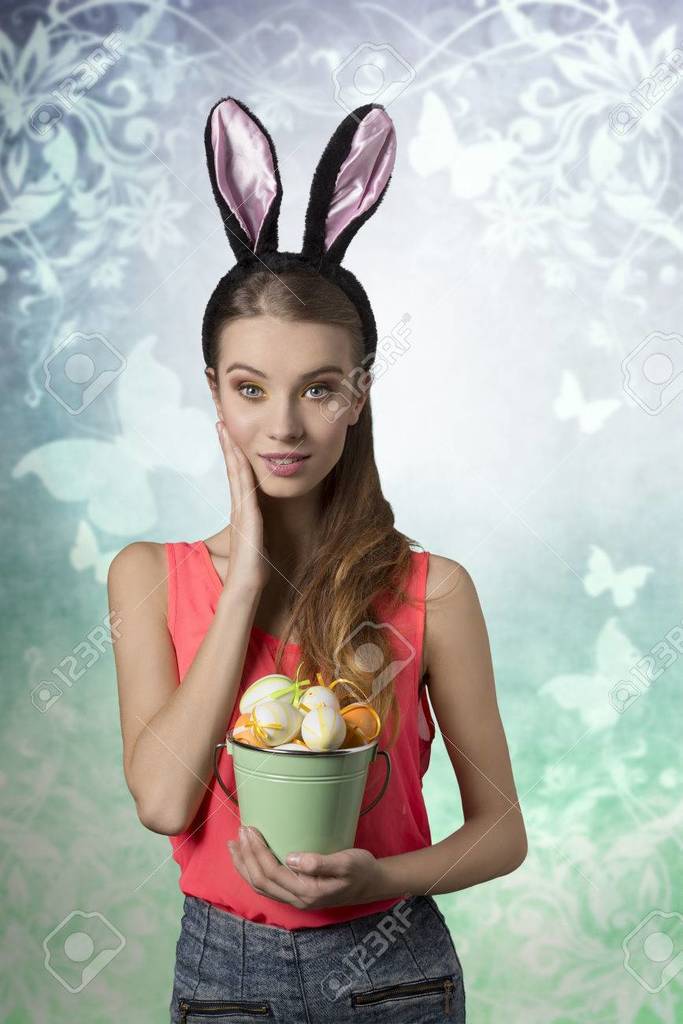 37734582-pretty-easter-girl-with-rabbit-fluffy-ears-and-bucket-of-easter-eggs-sh.jpg