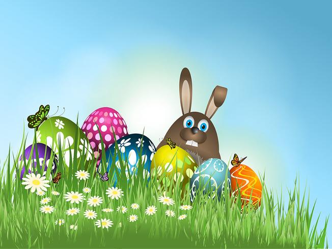 vector-easter-bunny-in-grass-with-eggs.jpg