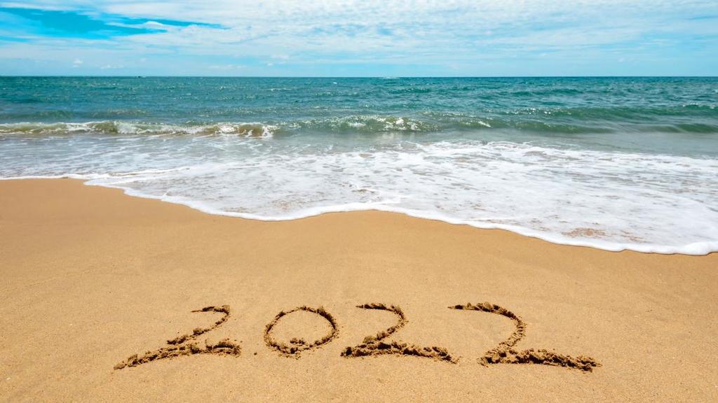 New-Year-Concept-Welcoming-New-Year-2022-Written-on-a-Sand-Beach.jpg