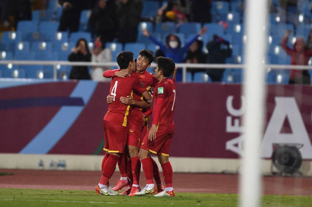 Vietnam’s players celebrate after scoring against China.jpg