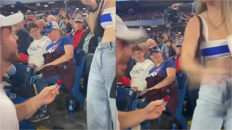一名男子日前在MLB賽事上當眾下跪，裝作要向女友求婚，沒想到他竟拿出玩具糖果戒指惡整對方。.jpg.jpg