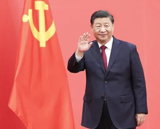 習近平出席新年茶話會 明年堅持穩中求進 2024年GDP增5%.jpg