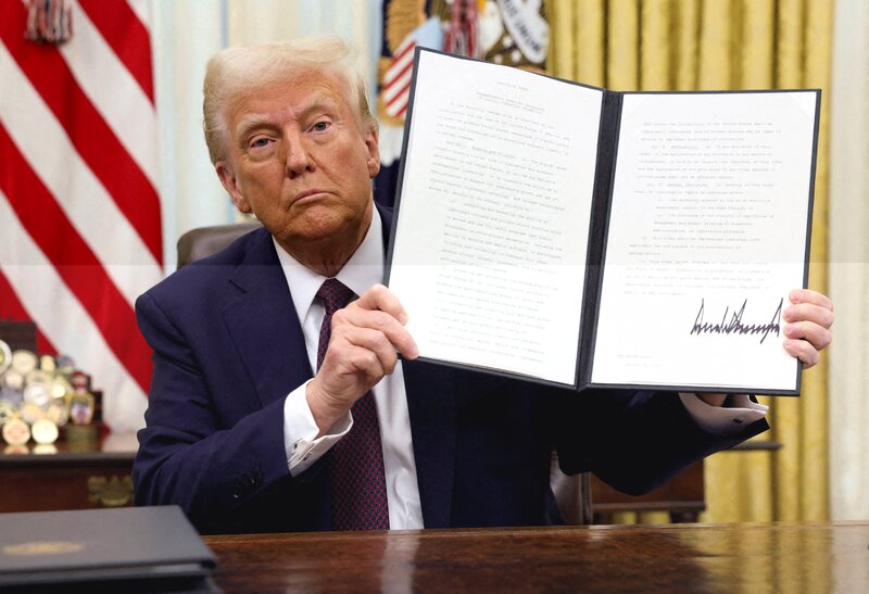 FILE-PHOTO-U-S--President-Trump-signs-an-executive-order-in-the-Oval-Office-at-t.jpeg